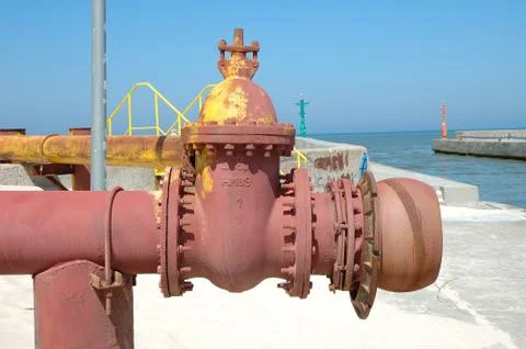 Old and rusty pipe on the beach Stock Photos