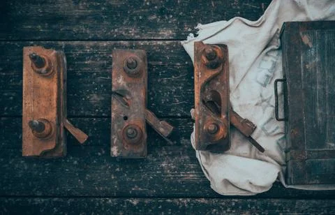 Old and rusty tools on a old board background. Flat lay and top view Stock Photos