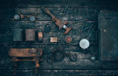 Old and rusty tools on a old board background. Flat lay and top view Stock Photos