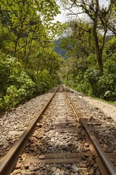Old and rusty train tracks, along the Urubamba River, Peru. Stock Photos