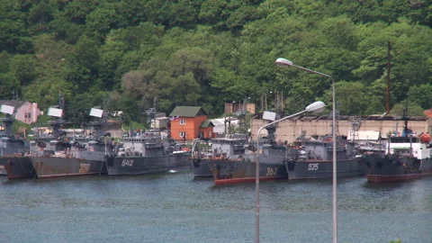 Old and rusty warships are at the pier Stock Footage 92200158