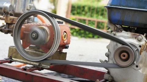Old and rusty water pump motor with pulley wheel and belt with water or oil leak Video stock 93275451
