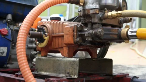 Old and rusty water pump motor with pulley wheel and belt with water or oil leak Video stock 93275468