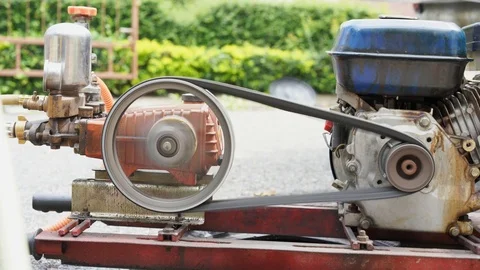 Old and rusty water pump motor with pulley wheel and belt with water or oil leak Video stock 93275513