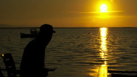 Old and sick man at sunset Stock Footage 125310623