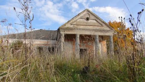 Old and soviet destroyed building from the times of the ussr in the field in Stock Photos