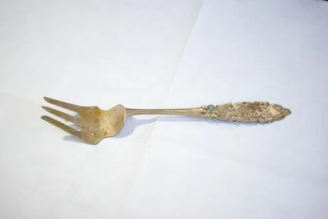 Old and worn large silver fork Stock Photos