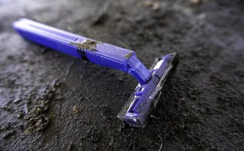 Old and worn out disposable razor Stock Photos