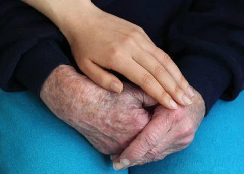Old and young hands Stock Photos