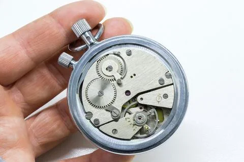 Old antiquary timer clock and humans hand Stock-Fotos