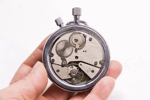 Old antiquary timer clock and humans hand Stock-Fotos