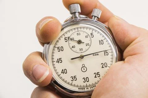 Old antiquary timer clock and humans hand Foto stock