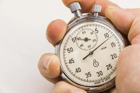 Old antiquary timer clock and humans hand Foto stock