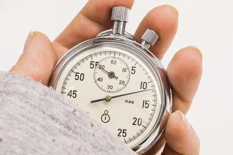 Old antiquary timer clock and humans hand Stock Photos