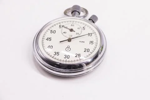 Old antiquary timer clock on the white background Foto stock