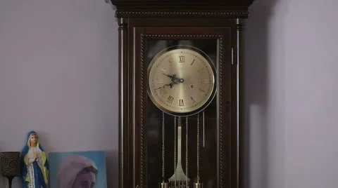 Old antique clock with statuette of the Virgin Mary Stock Footage 46197727