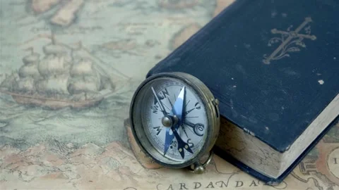 Old antique compass on vintage map. Adventure stories background. Travel, g.. Stock Footage 257871585