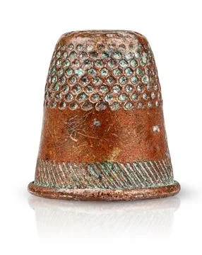 Old antique copper thimble Stock Photos