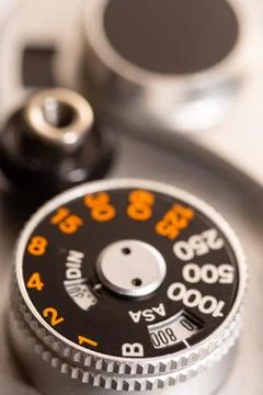 Old antique SLR camera shutter dial macro photo Stock Photos