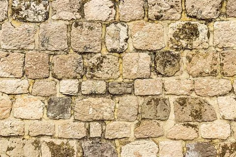 Old antique stone wall texture. Stock Photos