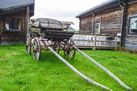 Old antique wooden chariot with classic rusty ride fascilities in northern Sw Stock Photos