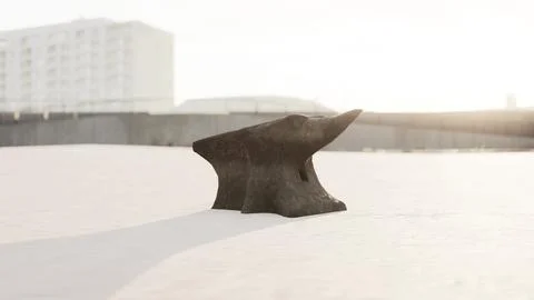 Old anvil on a sandy beach Stock Illustration