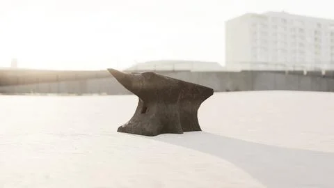 Old anvil on a sandy beach Stock Illustration