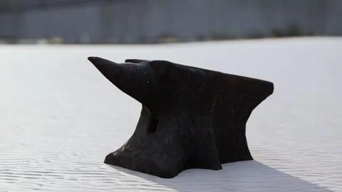 Old anvil on a sandy beach Stock Illustration