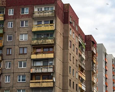 Old apartment blocks under cloudy sky Stock Photos