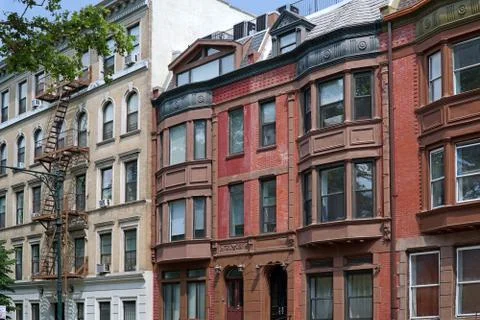 Old apartment building with external fire escape Stock Photos