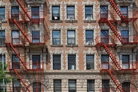 Old apartment building with external fire escape Stock Photos