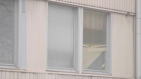 Old Apartment window with broken blinds, Ghetto Neighborhood scene, Close Up Video stock 251152159