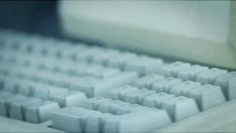 Old Apple macintosh computer on black background Stock Footage 104334696