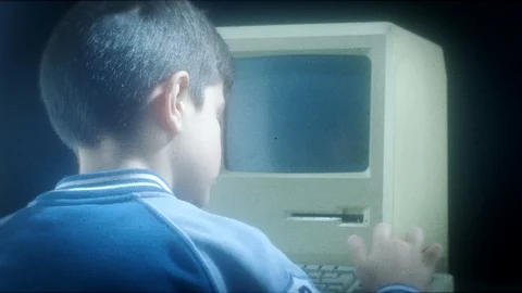 Old Apple macintosh computer on black background Stock Footage 104334767