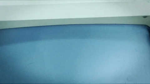 Old Apple macintosh computer on black background Stock Footage 104334902