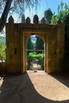 Old arch gate, path and staircase in granite to vineyards and typically Medit Stock Photos