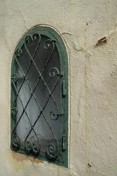 Old Arched Window With Grille Stock Photos