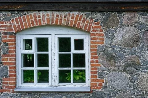 Old arched window. Stock Photos
