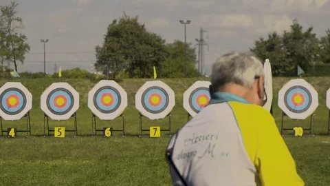 Old Archer Aiming at Target and Shooting Video stock 83161461