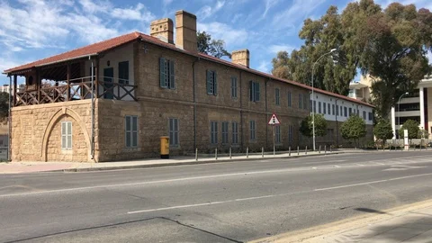 Old Architecture Building vs Black Taxi in Nicosia Stock Footage 89749294
