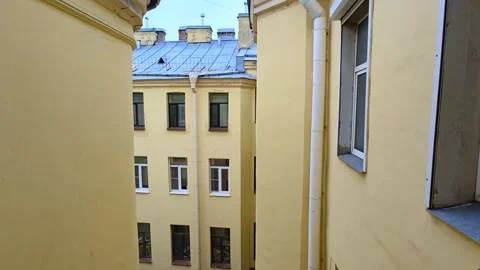 Old architecture of closed courtyards of St. Petersburg. Old yard well. Stock Footage 311495686