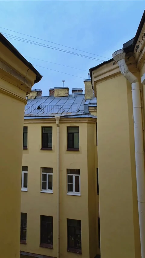 Old architecture of closed courtyards of St. Petersburg. Old yard well. Stock Footage 311576362