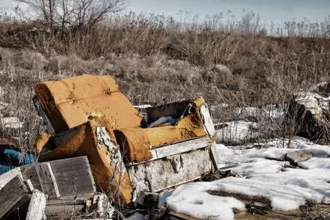 Old armchair on dump. Foto stock