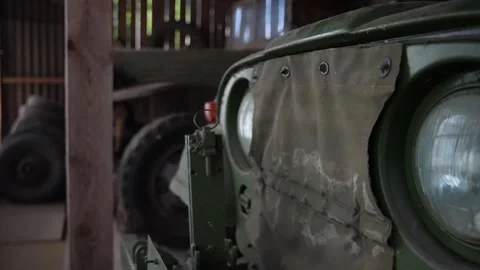 Old army jeep in a garage Stock Footage 294205461