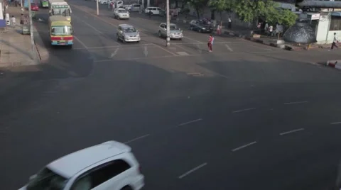 Old Asian Buses going around Roundabout in Yangon Burma Stock Footage 56632489