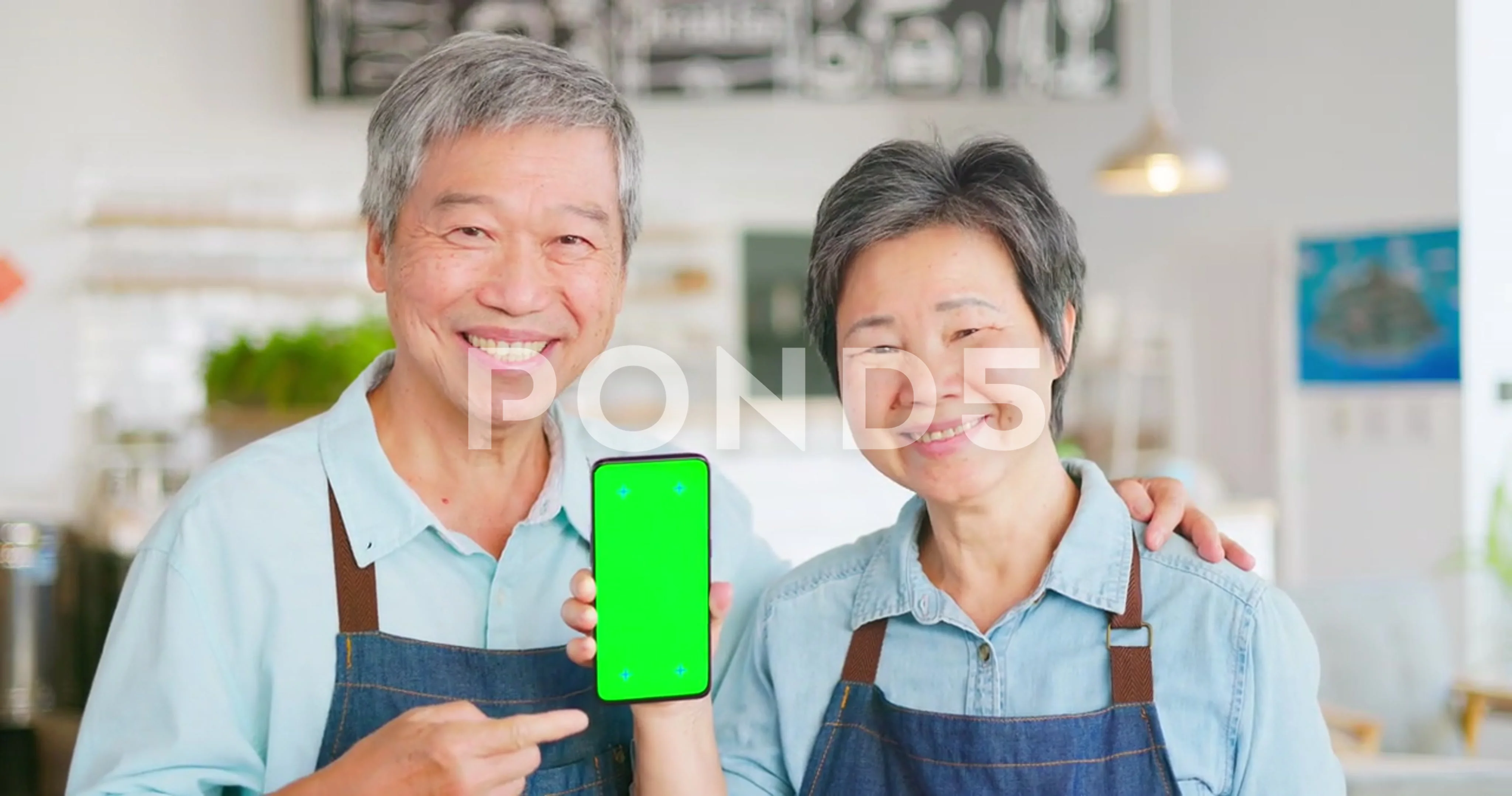 old asian couple use phone