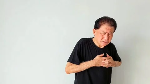 Old Asian Man Experiencing Heart Attack or Chest Pain Stock Footage 339278640