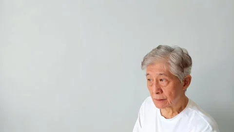 Old Asian Man Making Rejection Gesture by Shaking His Head Repeatedly Vídeos de archivo 345860355