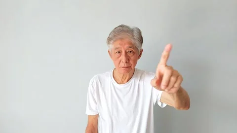 Old Asian Man Making Rejection Gesture by Wagging Index Finger in Slow Motion Vídeos de archivo 345880976
