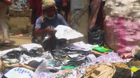An old Asian man works hard as a paper collector, emphasizing the tough Video stock 234982017